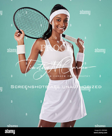 female-tennis-player-posing-with-racket-getting-ready-for-competitive-match-and-looking-sporty-while-standing-against-blue-studio-background-active-fit-and-happy-professional-sports-person-2PRF0B5-275